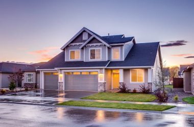 Blue and Gray Concrete House With Attic during Twilight